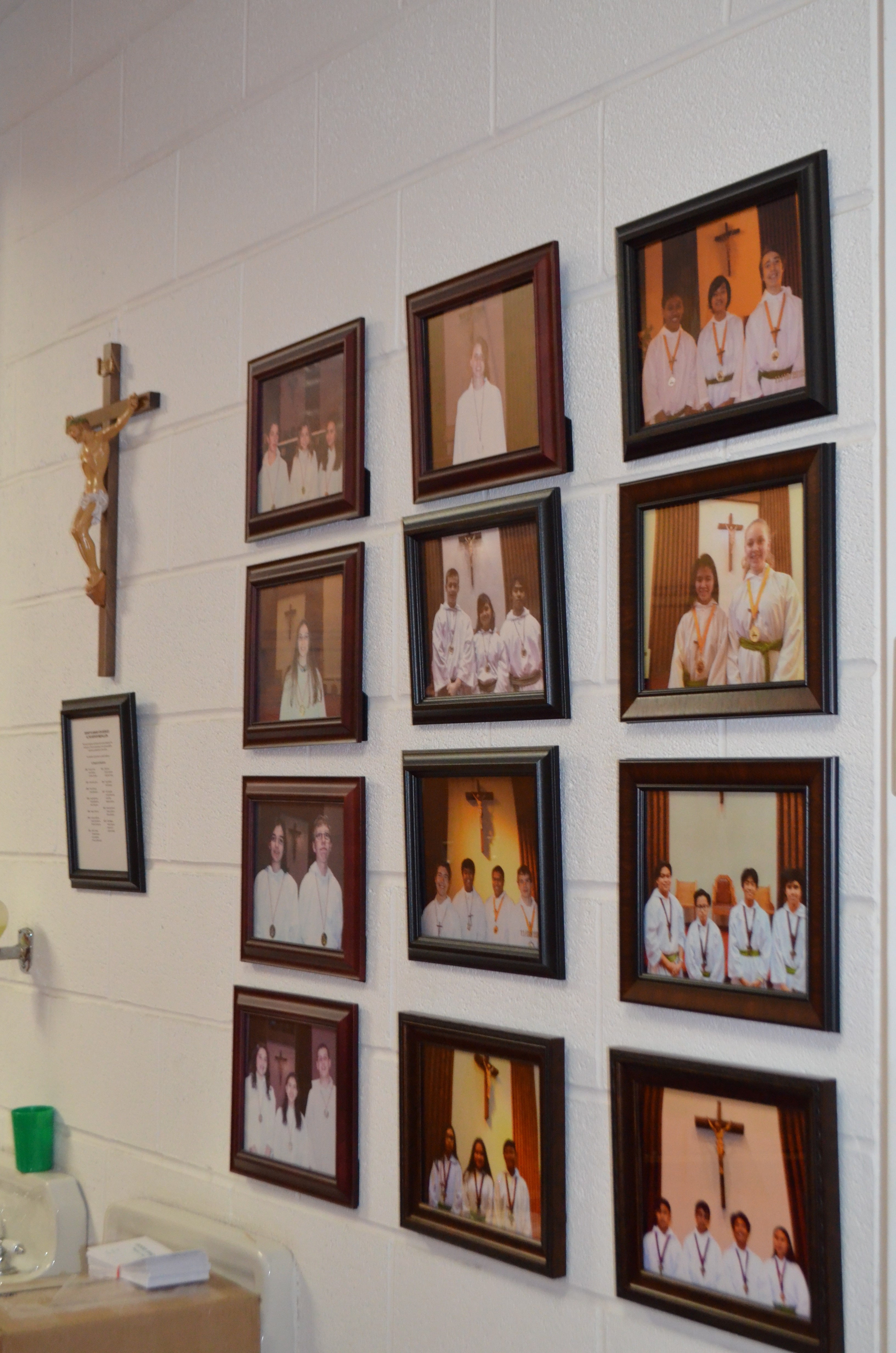 Hanging pictures in sacristy