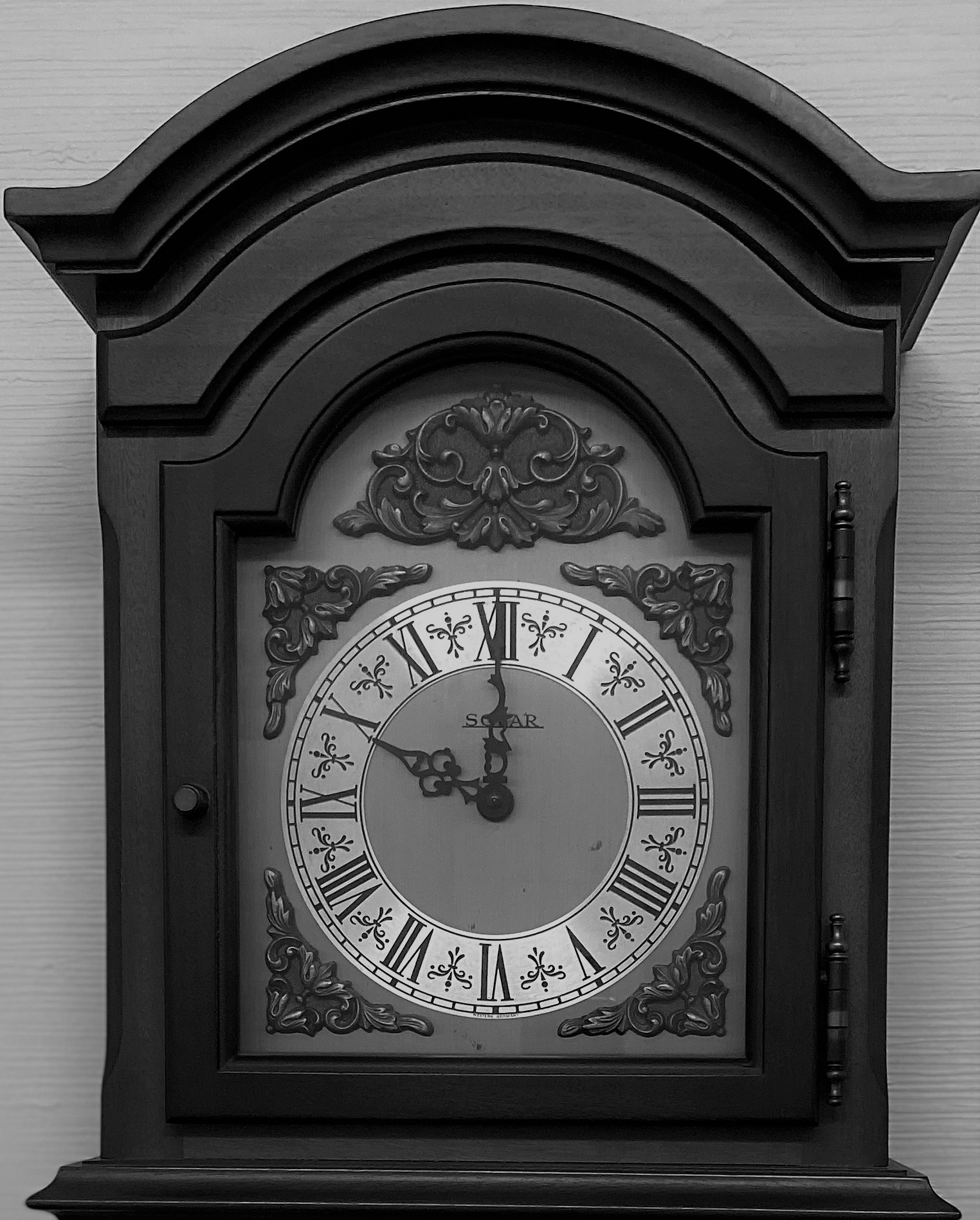 Clock in black in white