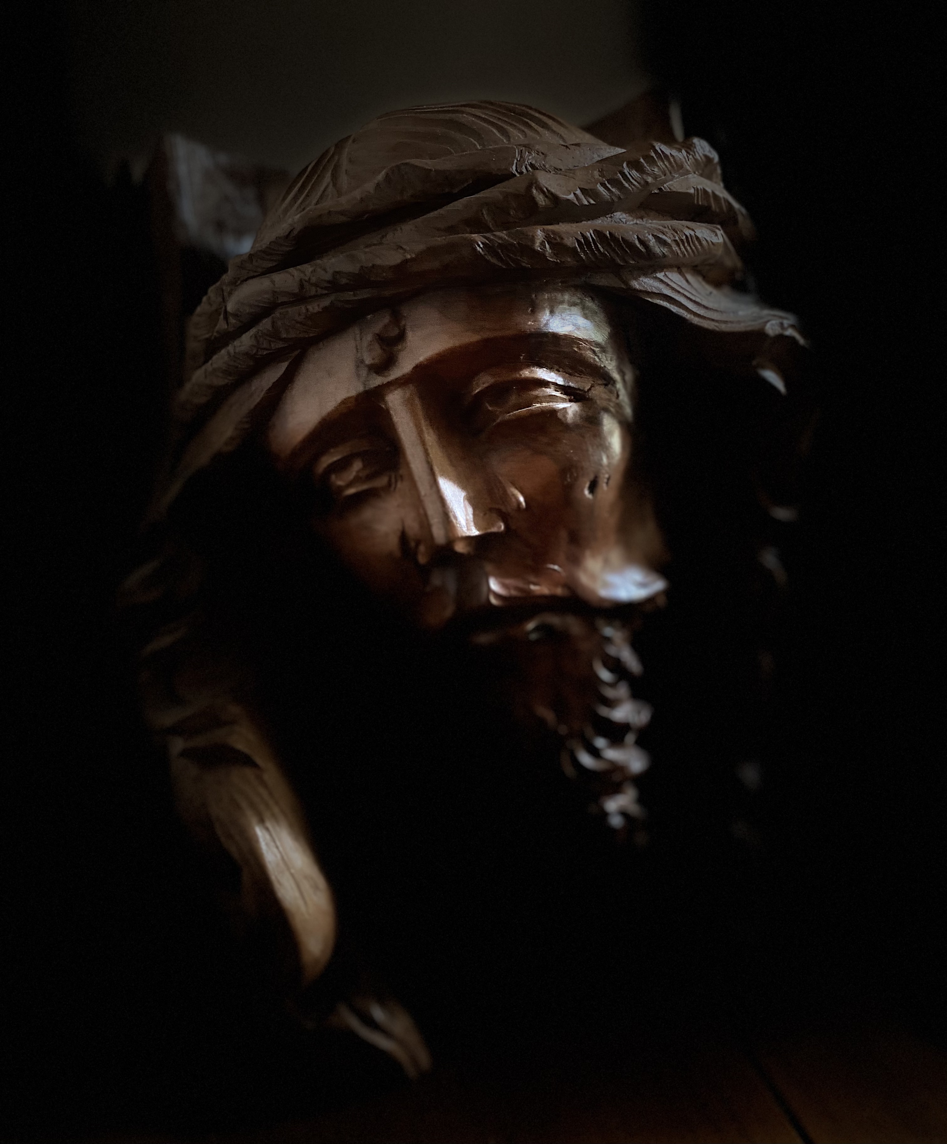 Jesus face on the cross with low light background